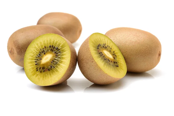 Whole and cut golden kiwifruits — Stock Photo, Image