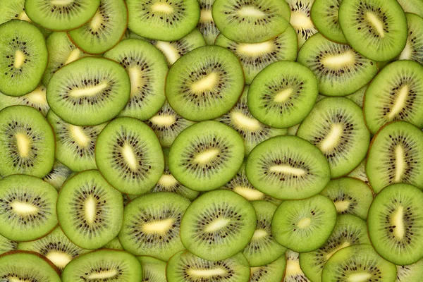 Fette di kiwi come sfondo — Foto Stock