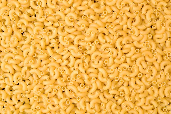 Organic dry pasta in pile — Stock Photo, Image
