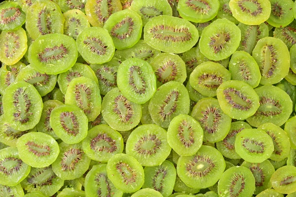 Kiwi segmenten als achtergrond — Stockfoto