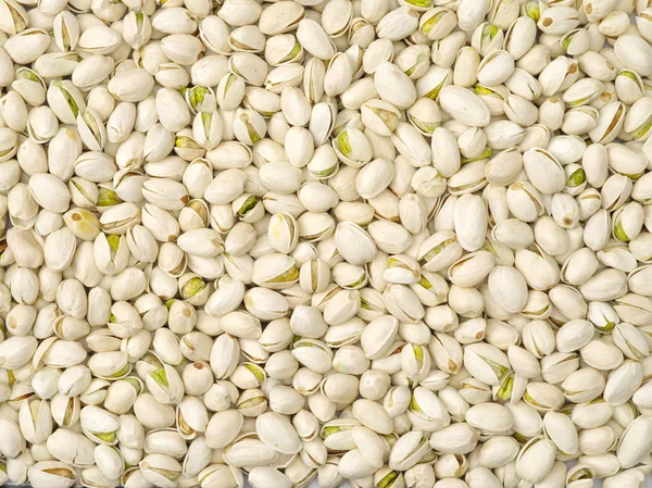 Pistachos tostados y salados en cáscara (textura, fondo) —  Fotos de Stock