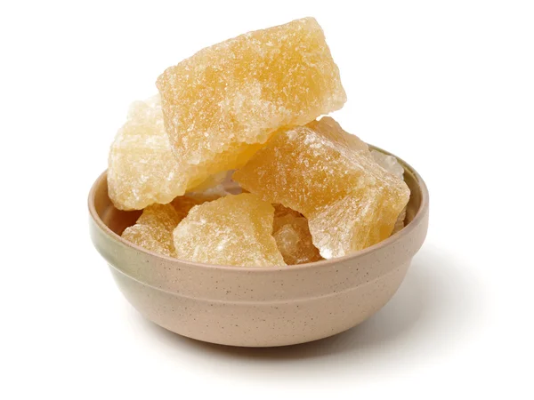 Brown crystal sugar on white — Stock Photo, Image