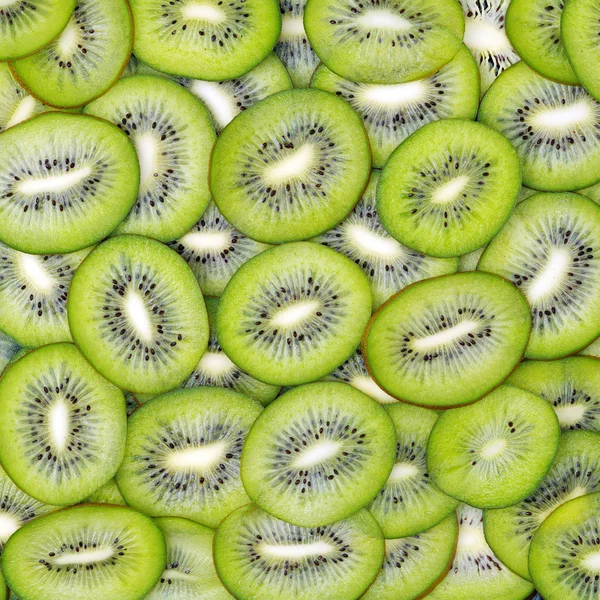 Kiwi segmenten als achtergrond — Stockfoto