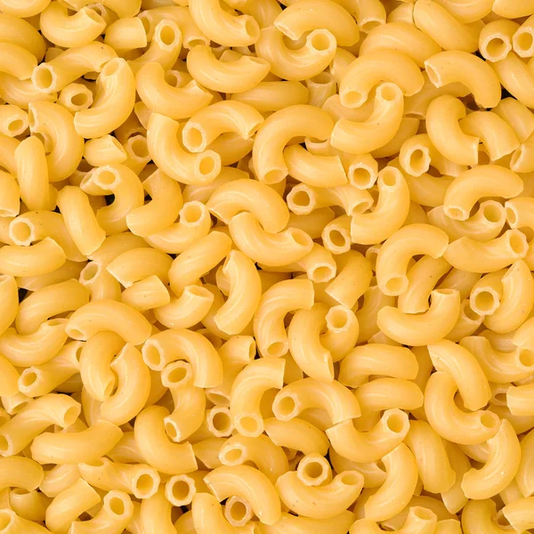 Ruwe pasta in stapel — Stockfoto