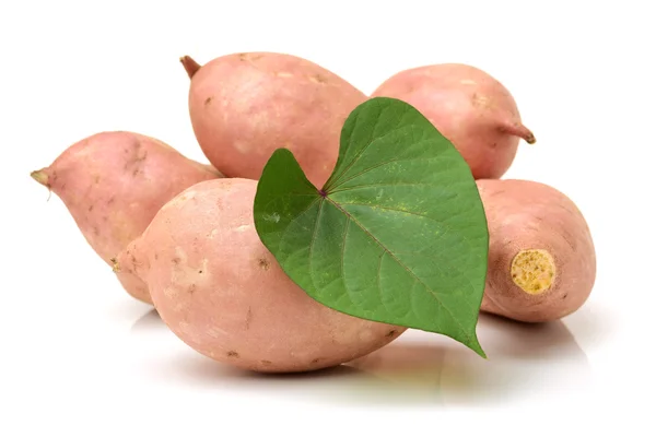 Sweet potatoes on the white — Stock Photo, Image