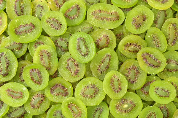 Kiwi segmenten als achtergrond — Stockfoto