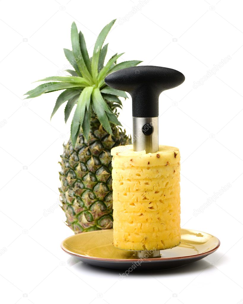 Pineapple, peeled pineapple, and hand corer isolated on white background