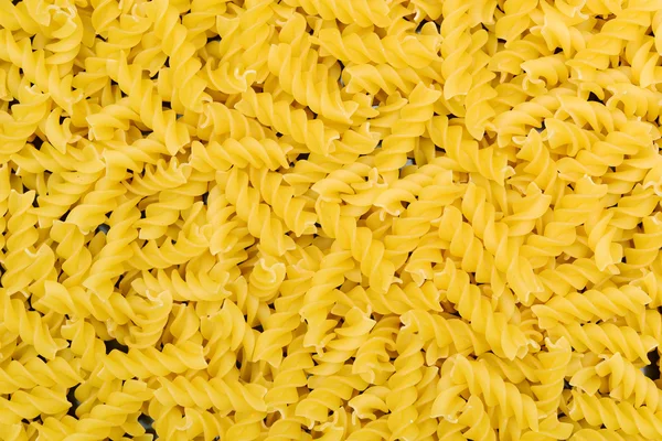 Golden pasta in pile — Stock Photo, Image