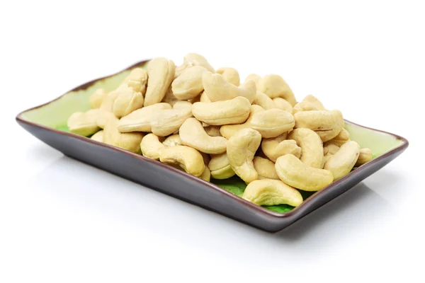Cashewnötter på tallrik närbild — Stockfoto