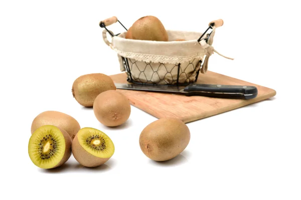 Whole and cut golden kiwifruit/ — Stockfoto