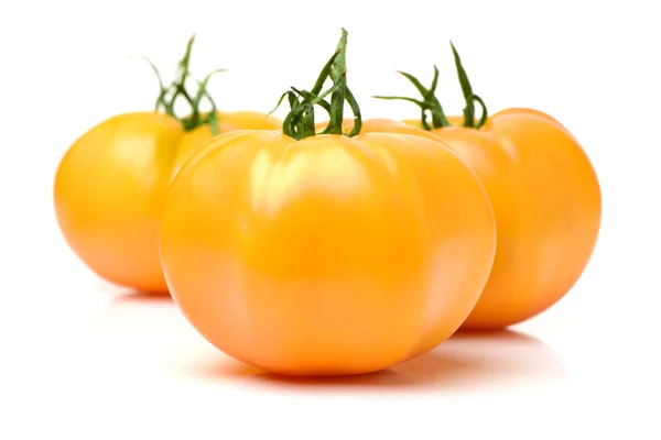 Fresh yellow tomatoes on white — Stock Photo, Image