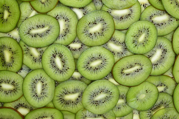 Fette di kiwi come sfondo — Foto Stock