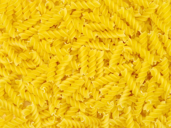 Gouden pasta in stapel — Stockfoto