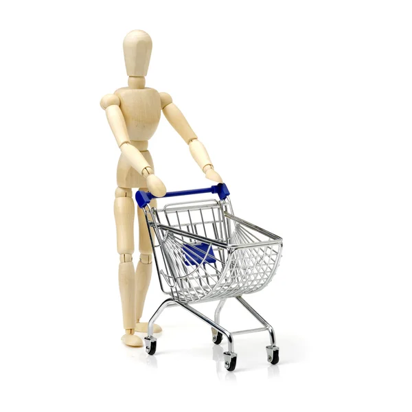Shopping concept. Wooden doll and — Stock Photo, Image