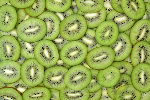 Fette di kiwi come sfondo — Foto Stock