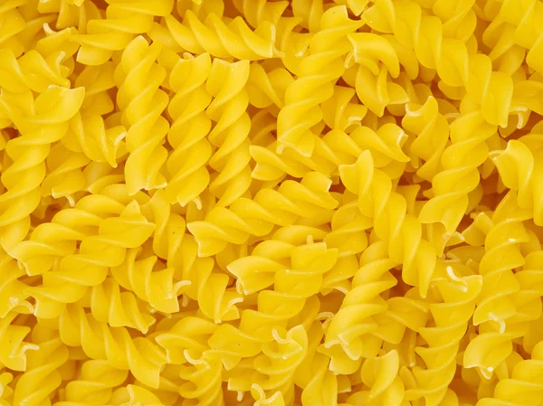 Gouden pasta in stapel — Stockfoto