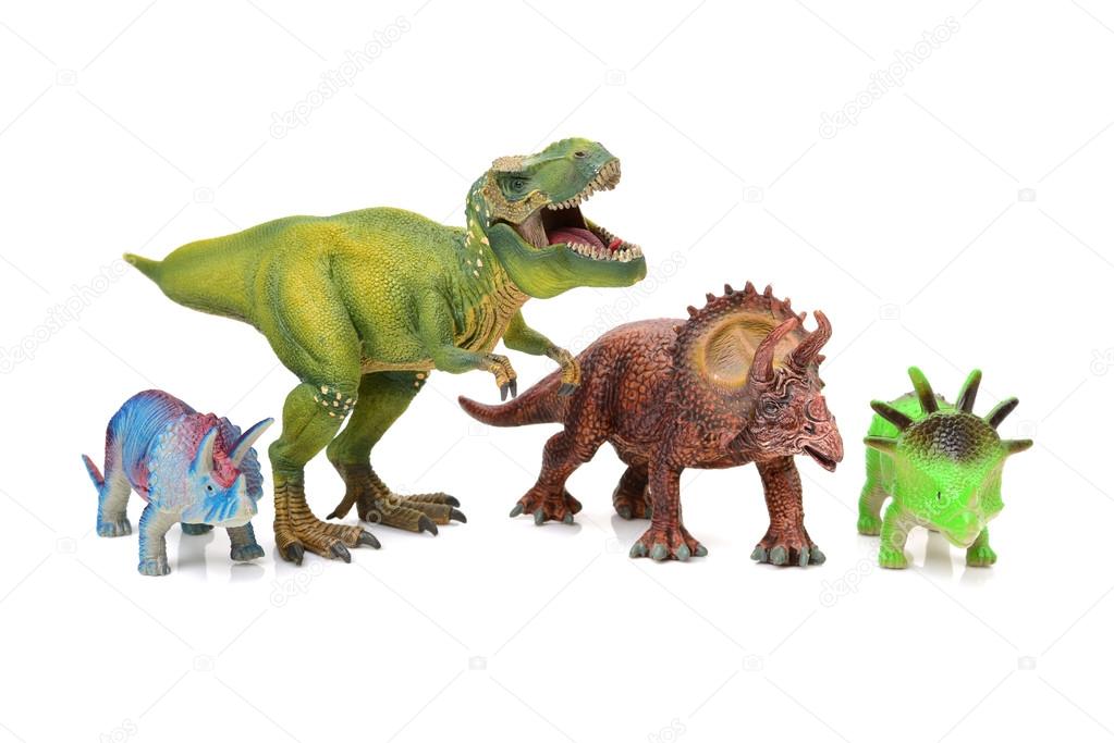 dinosaurs toys on white background