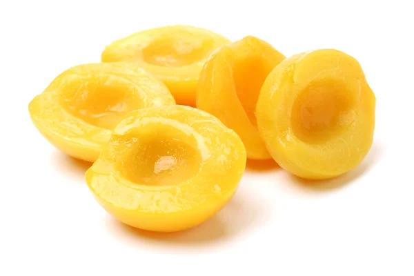 Peaches in syrup on a — Stock Photo, Image