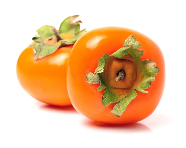 Dwa świeże persimmons — Zdjęcie stockowe