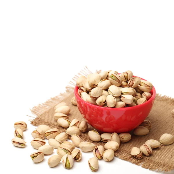 Dried pistachios with bowl — Stock Photo, Image