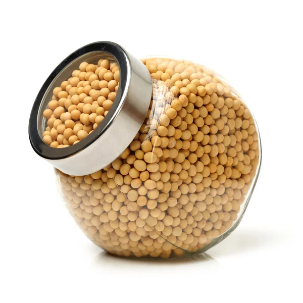 Bottle in soy beans — Stock Photo, Image