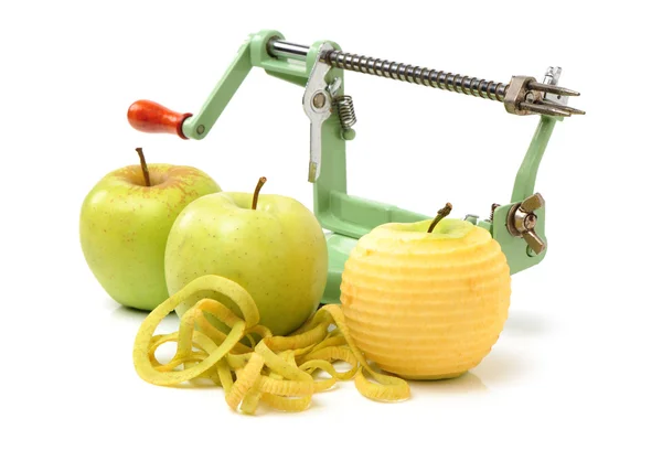 Manzanas verdes y pelador de manzanas — Foto de Stock
