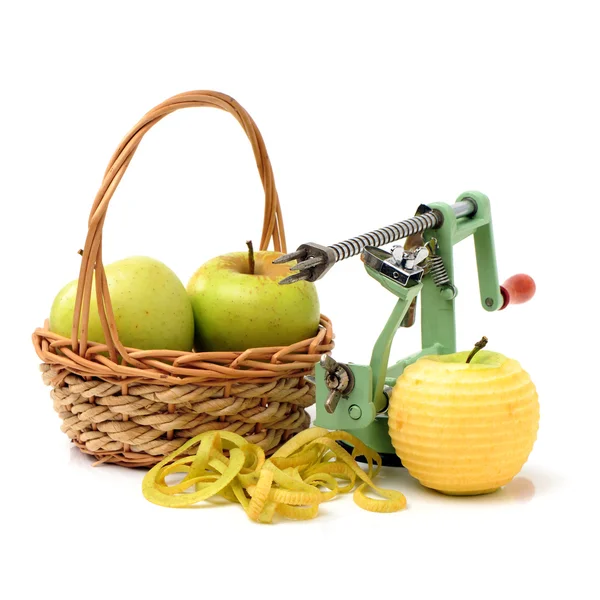 Green Apples and apple peeler — Stock Photo, Image