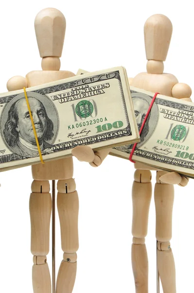 Dollars bank notes in wooden puppets hands — Stock Photo, Image