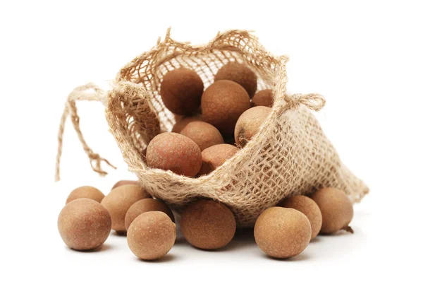 Macadamia nuts in textile bag — Stock Photo, Image