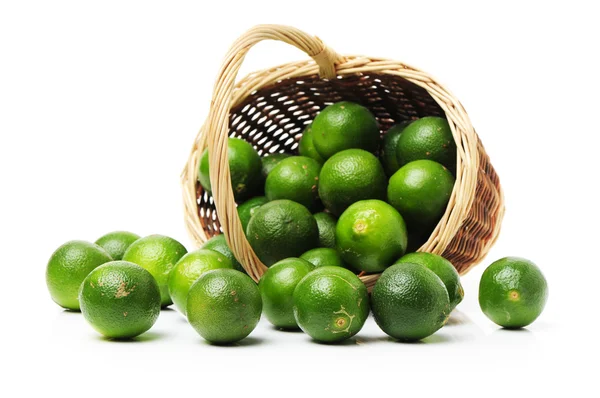 Fresh limes in the basket — Stock Photo, Image