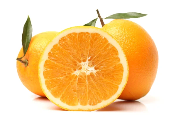 Fresh juicy oranges with leaves — Stock Photo, Image