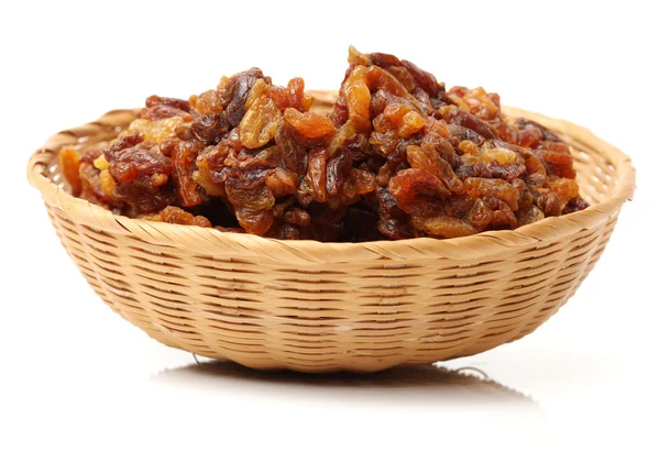 Brown raisins on white — Stock Photo, Image