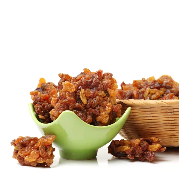 Brown raisins on white — Stock Photo, Image