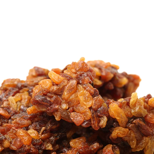 Brown raisins on white — Stock Photo, Image