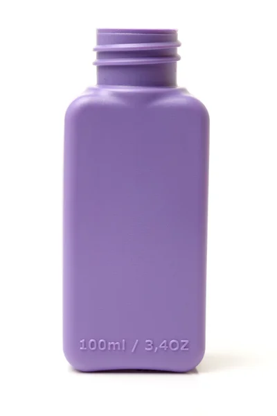 Barevná plastová láhev na bílém pozadí — Stock fotografie