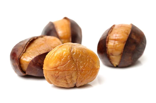 Sweet chestnuts on white — Stock Photo, Image
