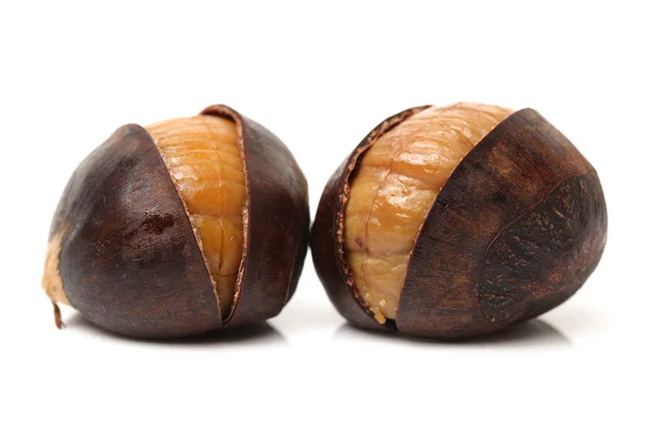 Sweet chestnuts on white — Stock Photo, Image