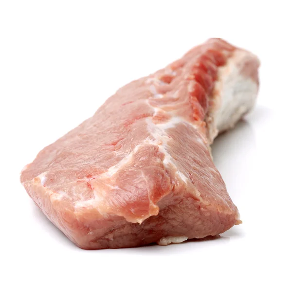 Rohes Schweinefleisch auf weißem — Stockfoto