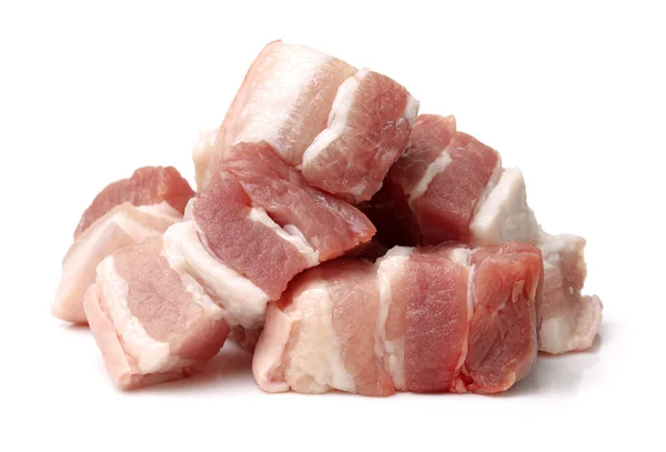 Rohes Schweinefleisch auf weißem — Stockfoto