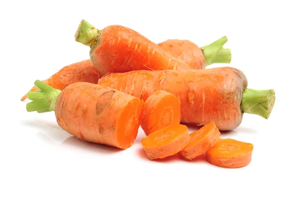 Whole and sliced fresh carrots — Stock Photo, Image