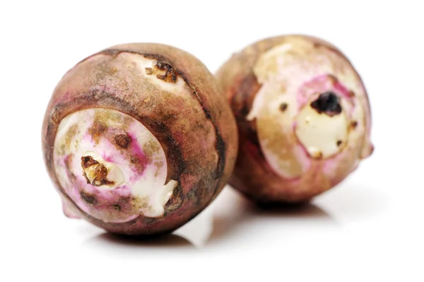 Taro root op wit — Stockfoto