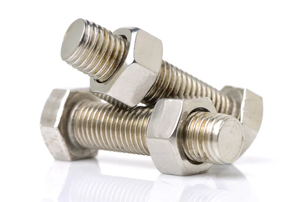 Bolts and nuts on white — Stock Photo, Image