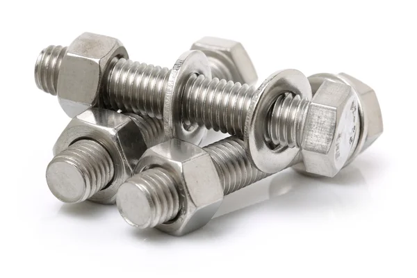 Bolts and nuts on white — Stock Photo, Image