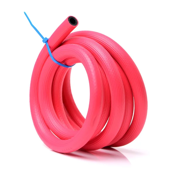 Plastic red rolled up hose — Stock Photo, Image