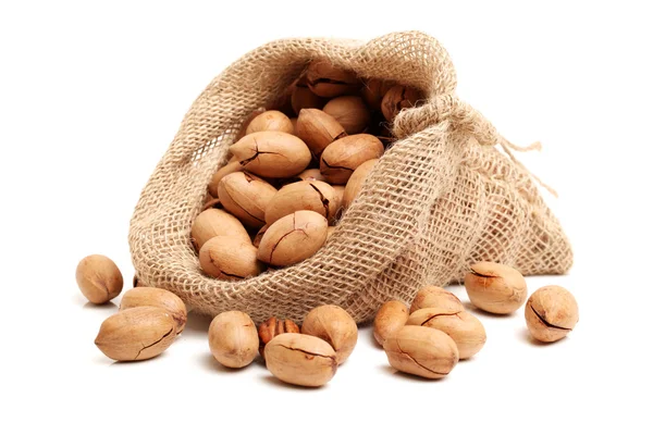 Peanuts in bag on white — Stock Photo, Image