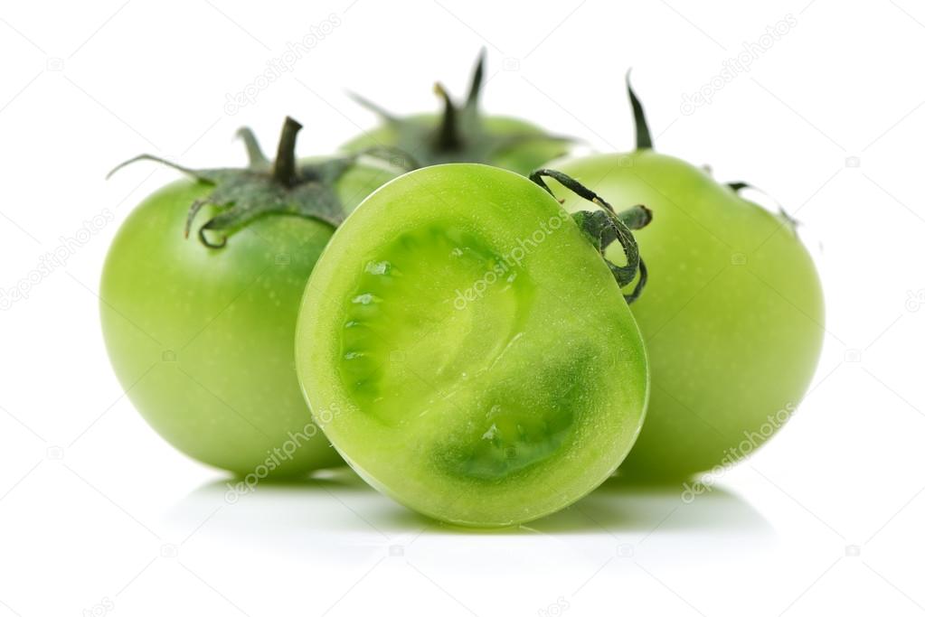 Whole and sliced green tomatoes