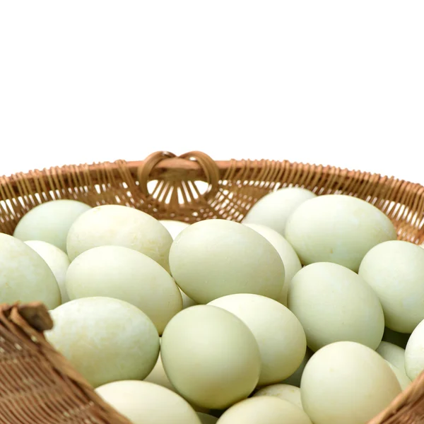 White chicken eggs in straw basket — Stock Photo, Image