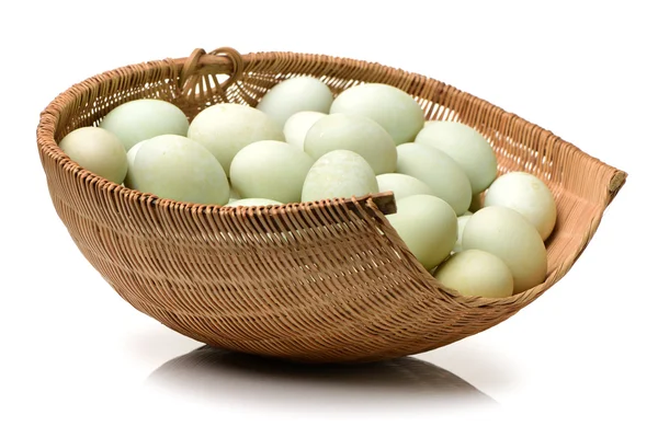 White chicken eggs in straw basket — Stock Photo, Image