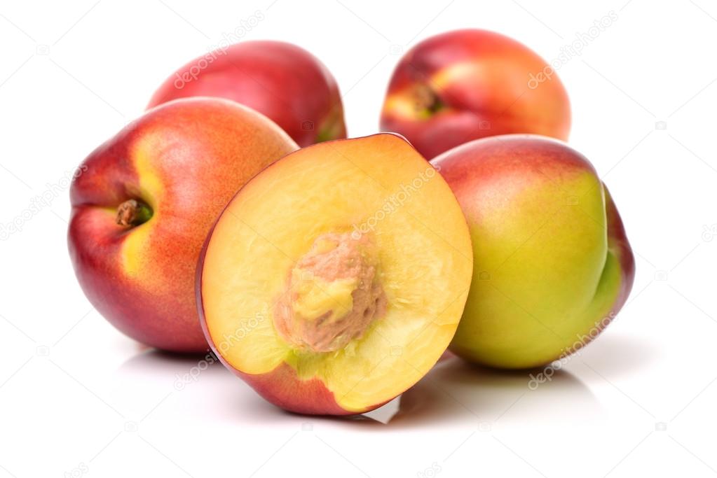 Pile of whole and sliced nectarines