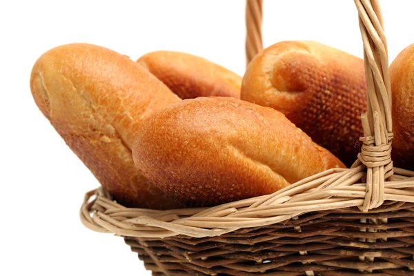 Fresh bread in straw basket — Stock Photo, Image